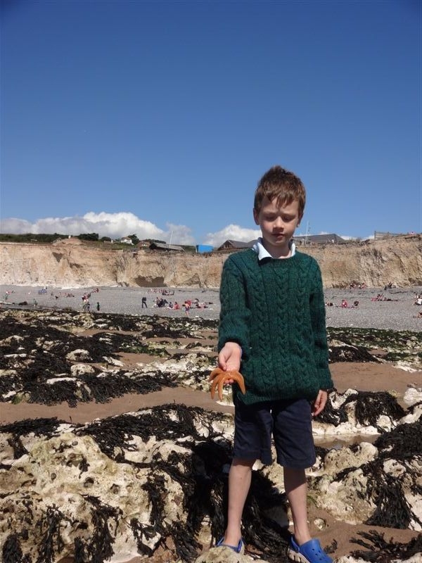 Nate with a starfish at Birling Gap