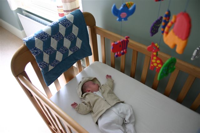 Nate in cot with Grandad's mobile