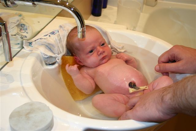 Bathing Nate in the bathroom sink