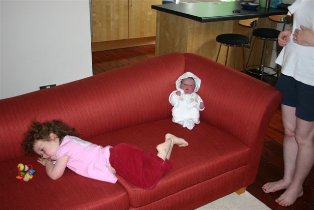 Anna and Nate sharing the sofa