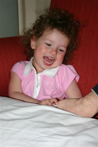 Anna being tickled by Daddy