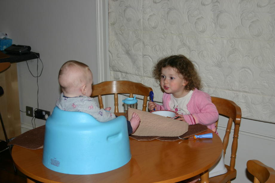 Nate and Anna at dining table talking to each other