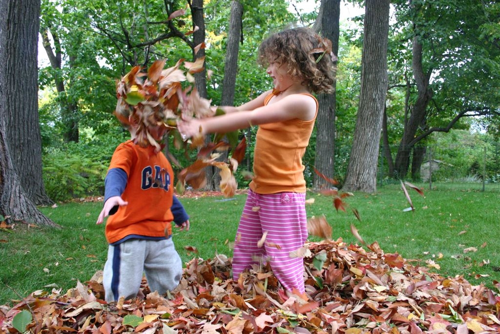 Anna throwing leaves on Nate's head